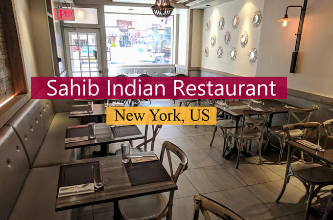 inside the dining area with all nicely designed restaurant tables of 'sahib indian restaurant' in new york, united states.